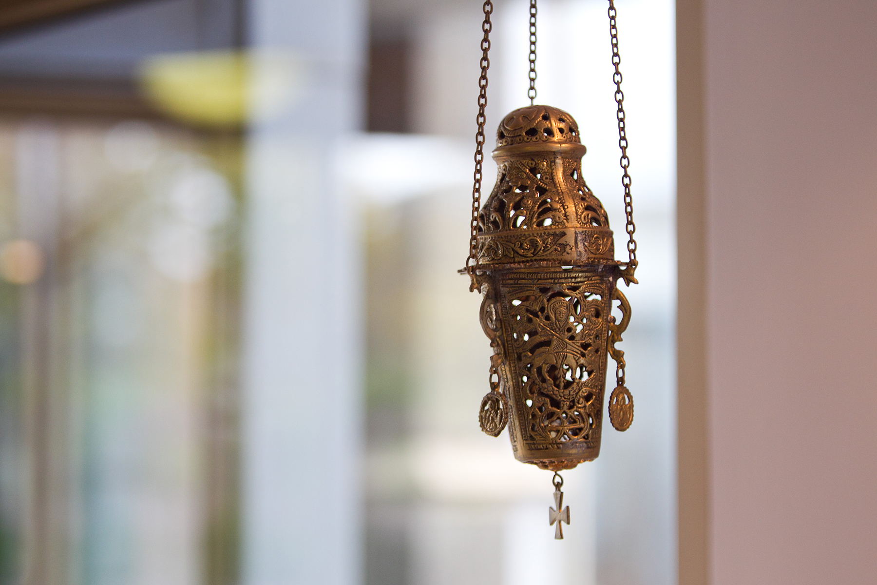 incense holder hanging by a window in the level 3 foyer of the Thomas Carr Centre