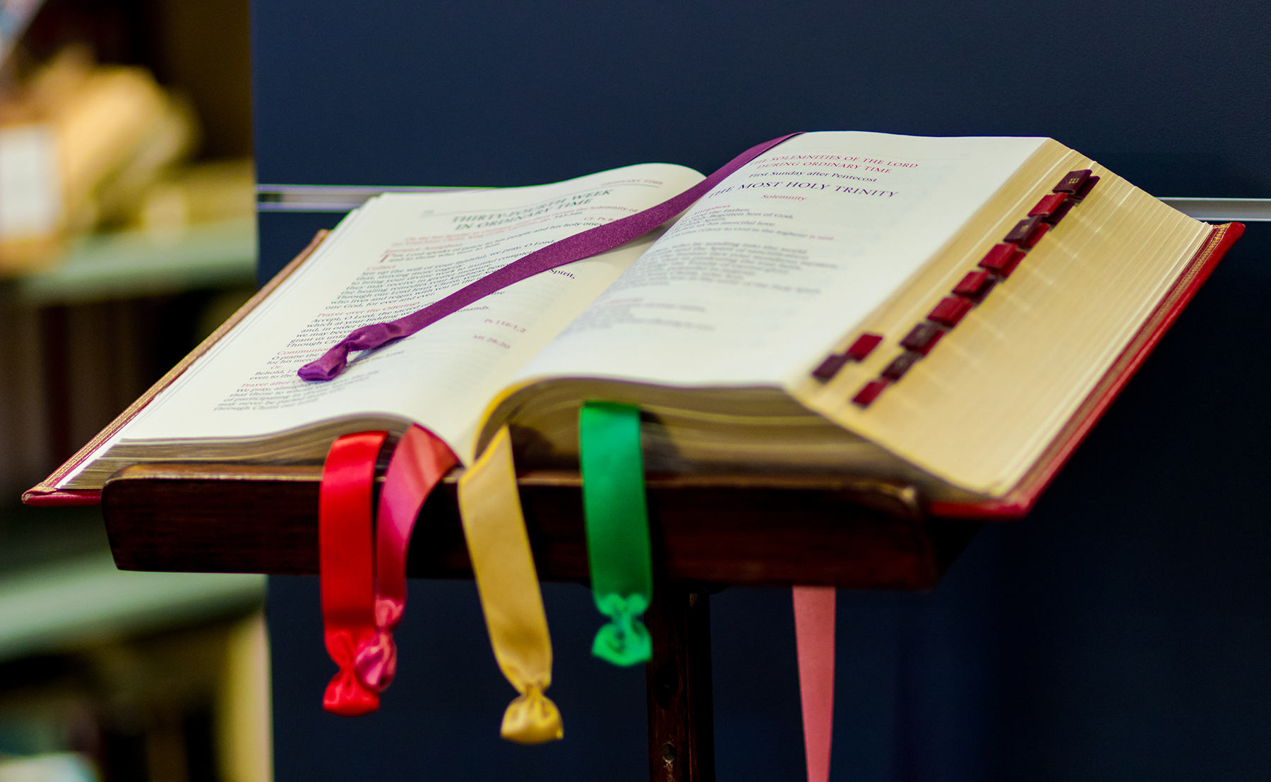 Open Roman Missal on a pedestal with coloured ribbon showing