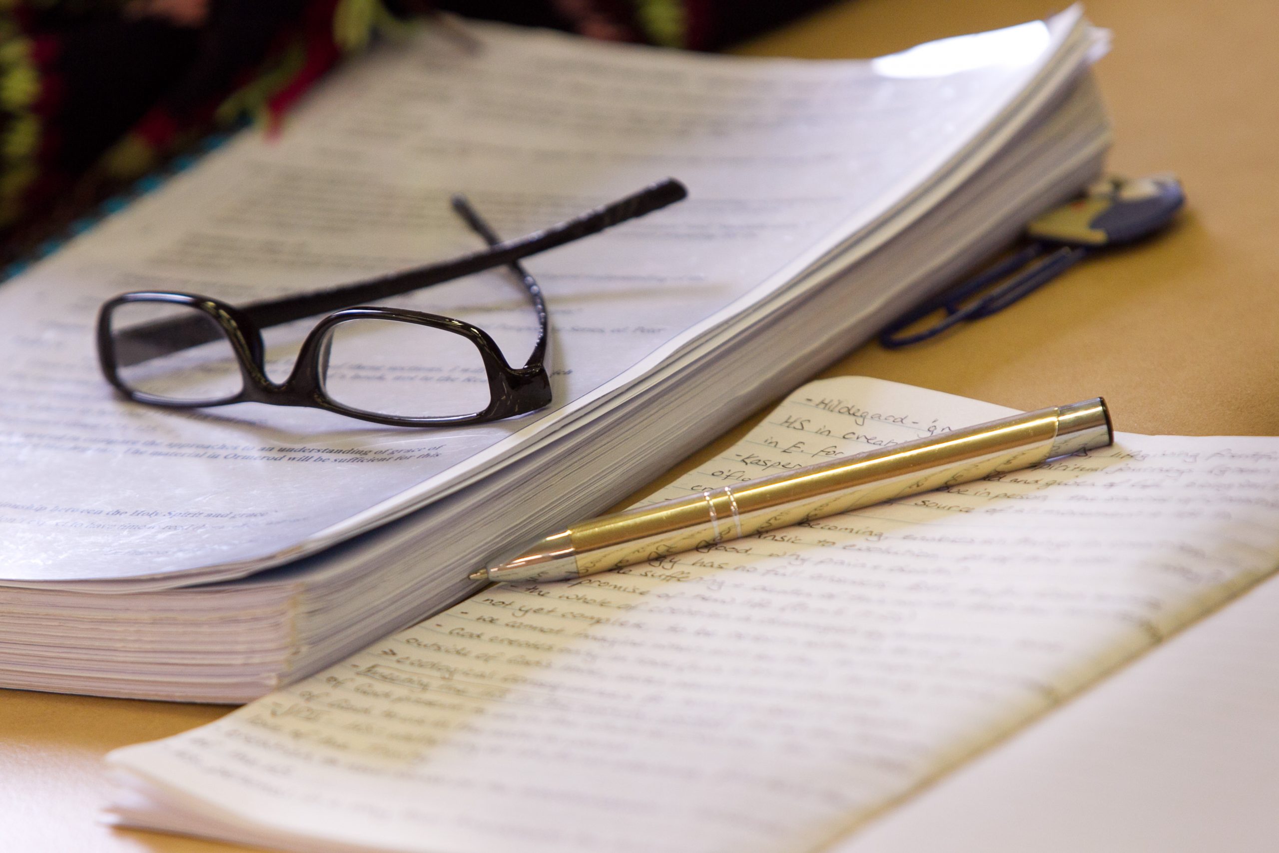 glasses, unit reader, notebook, pen